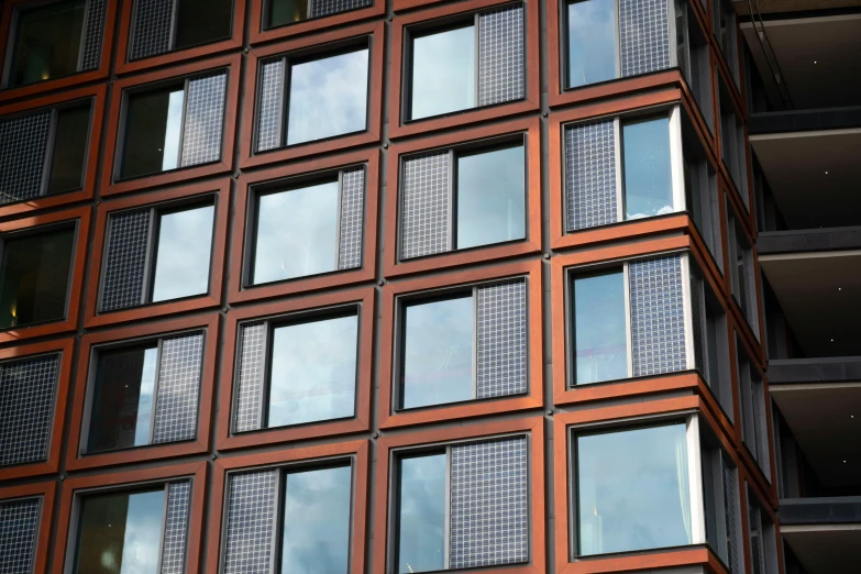 a very tall building with many windows next to it