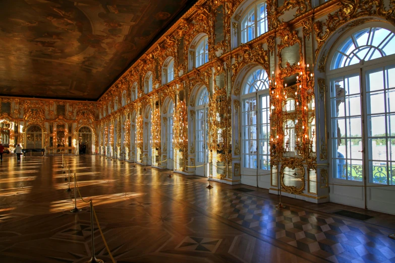 some gold ornate walls and windows in a room