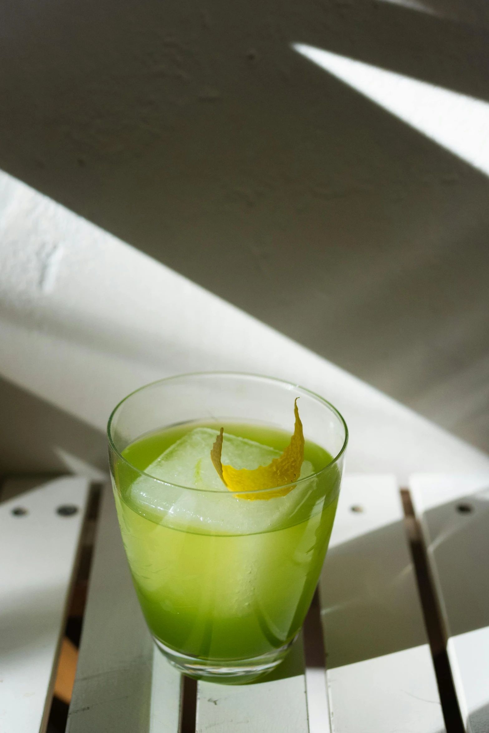 a small glass of lemonade on the counter