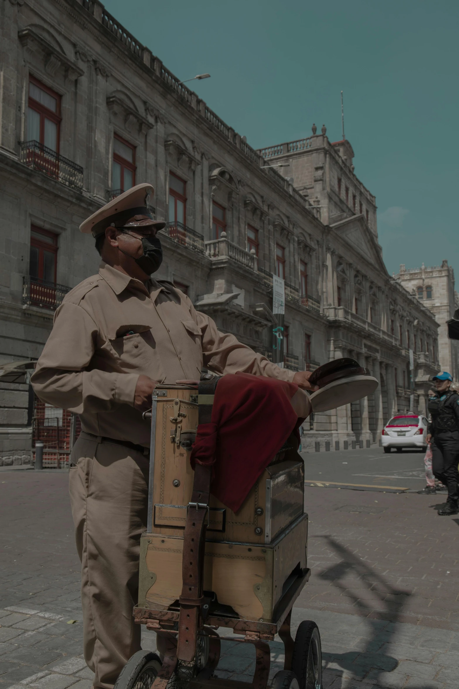 a man with brown hair is carrying luggage on the street