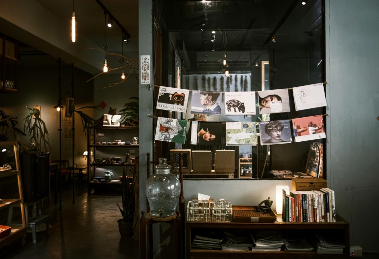 a view of a bookshop at night looking through the window