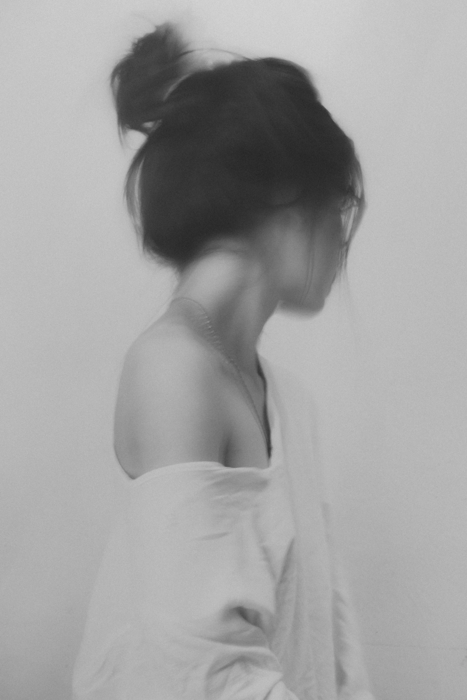 an abstract picture of a woman in a white shirt