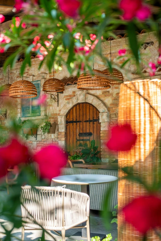 the outside furniture looks out onto a backyard garden