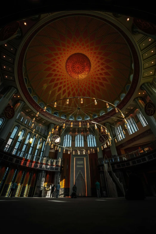 the interior of an indoor theater looking into the light from windows