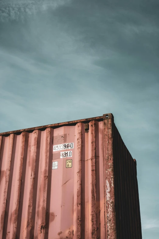 an empty rusted, old container sits alone