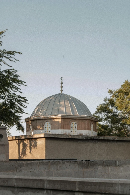 some steps are set near a dome with trees around it