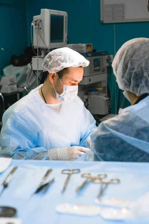 a doctor is checking a patient's utensils