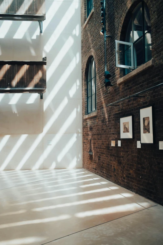 a building with several pictures on display under sunlight