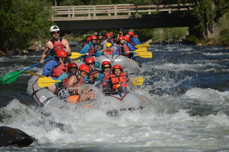 a group of people are rafting in a river