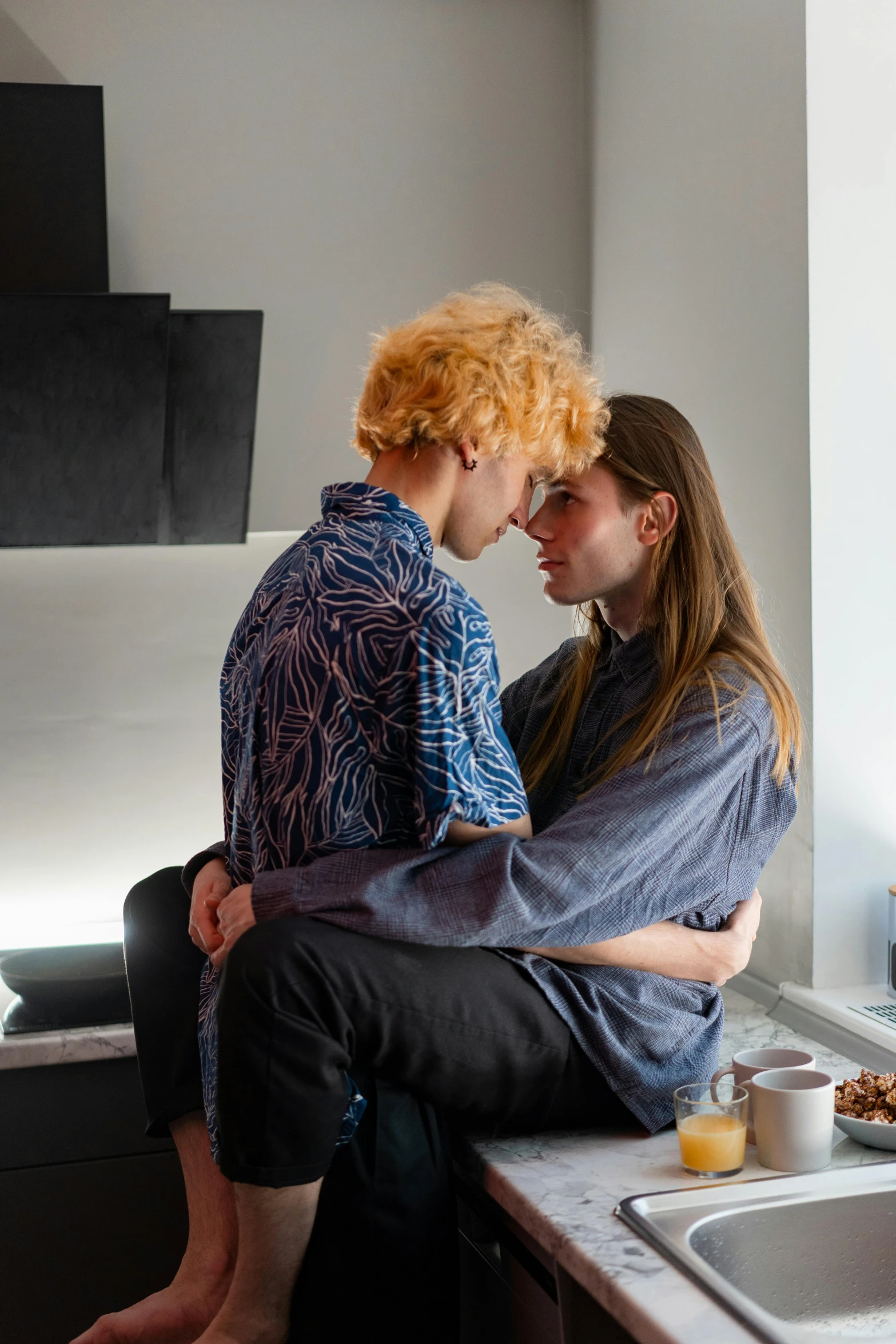 a couple sharing a romantic moment in the kitchen