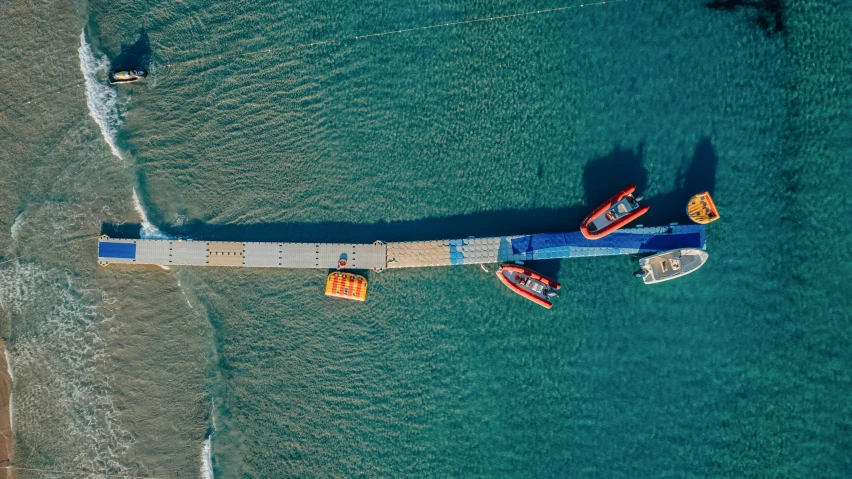 a barge on the water with some boats near by