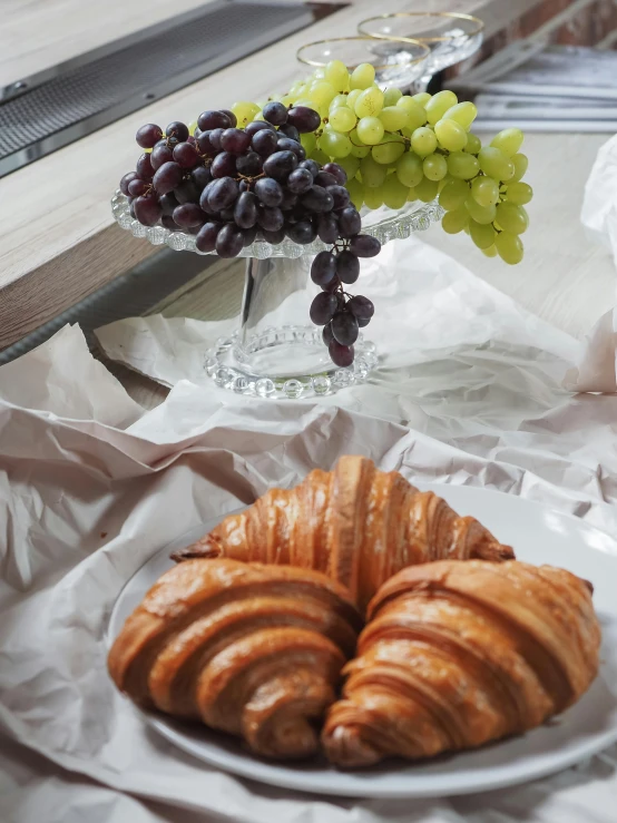 breakfast items and gs in the foreground on a plate