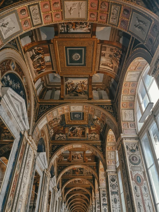 view looking down the length - line of a gothic corridor between two floors