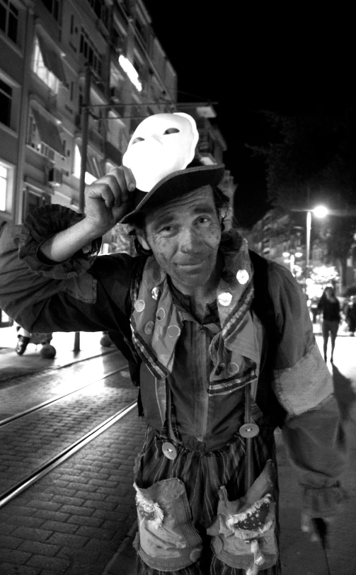 an elderly man walking on a street next to a building