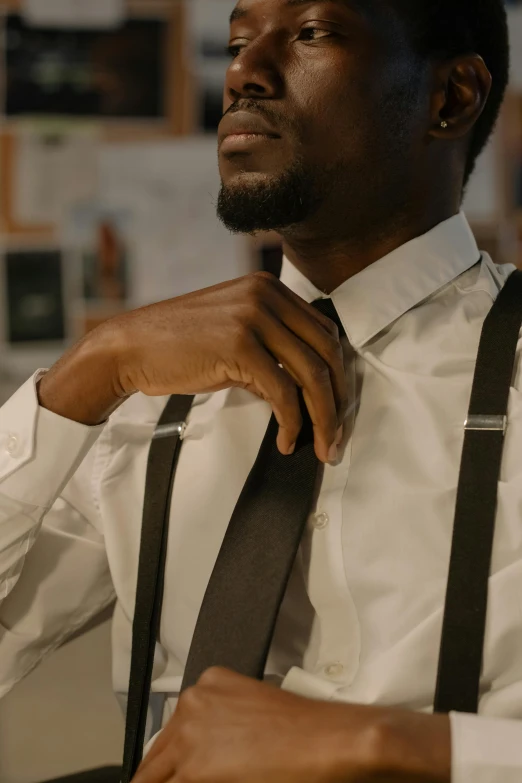 a person wearing a white shirt and brown tie