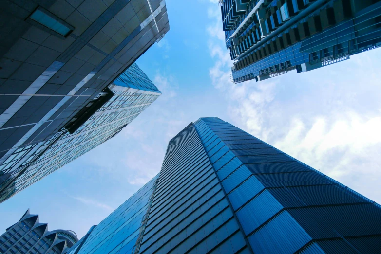 view looking up into the sky with buildings