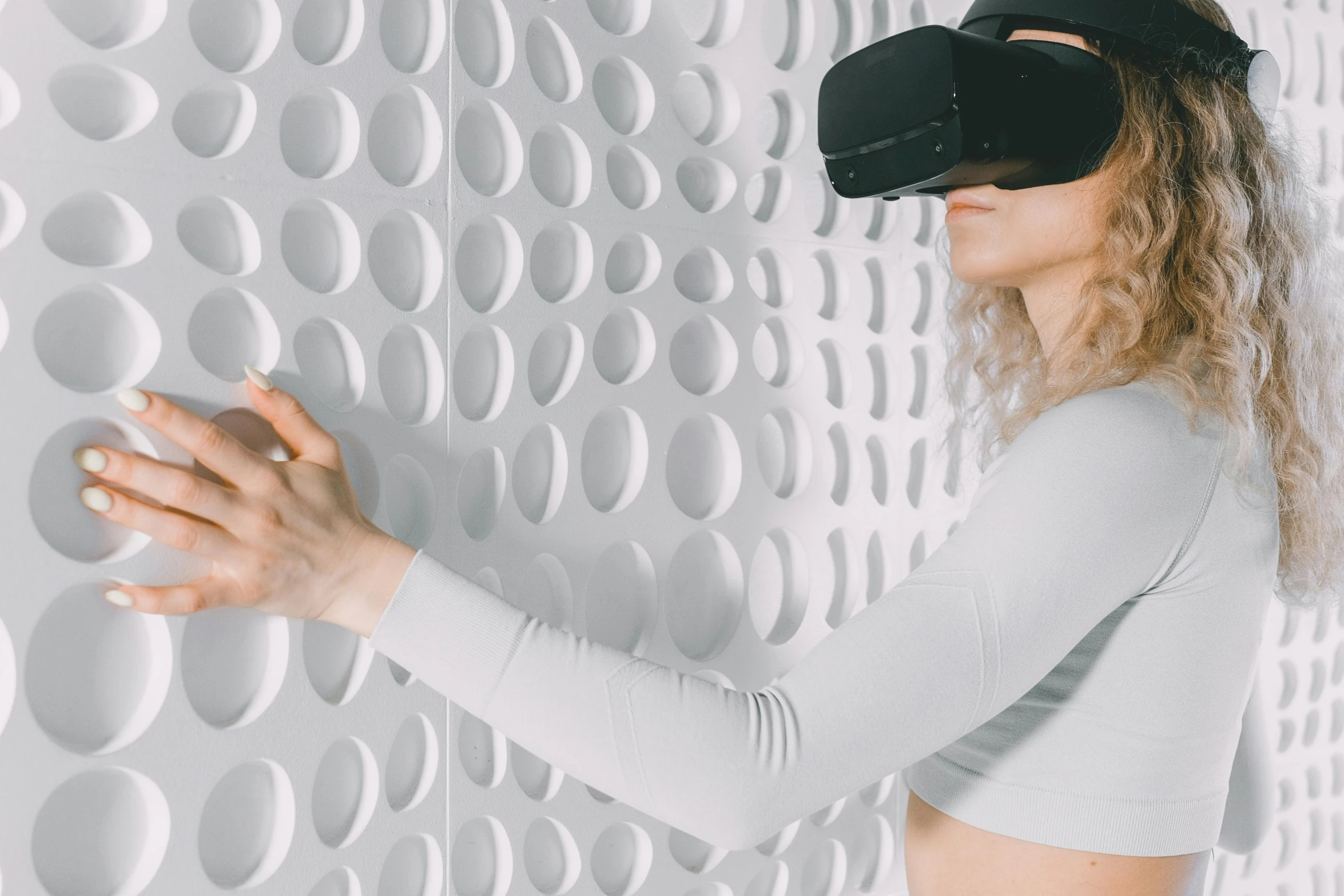 a woman wearing a blindfold and wearing a virtual reality mask