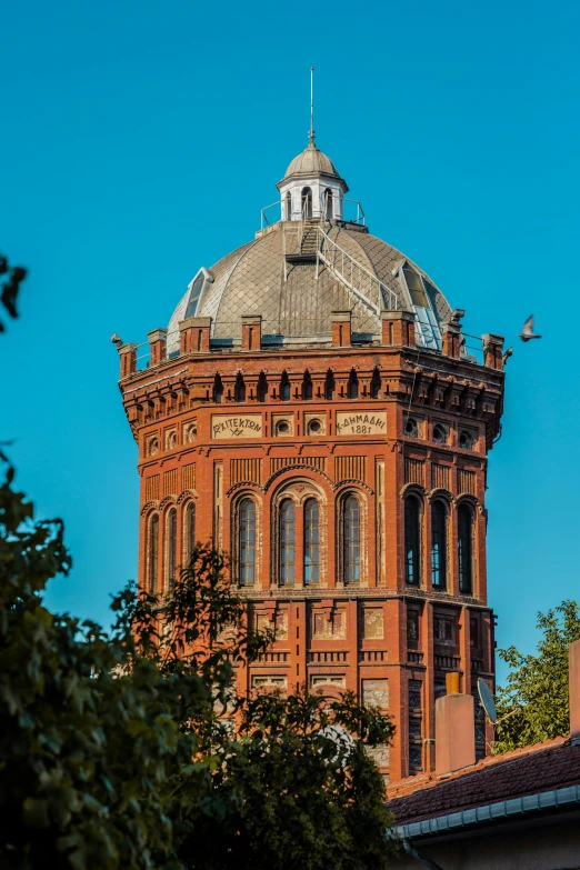 an old tower with dome and roof is shown