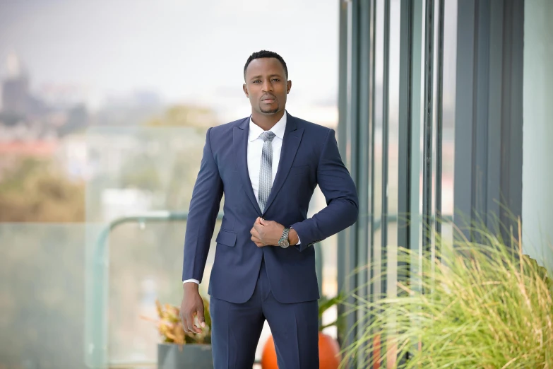 a man in a blue suit and white shirt