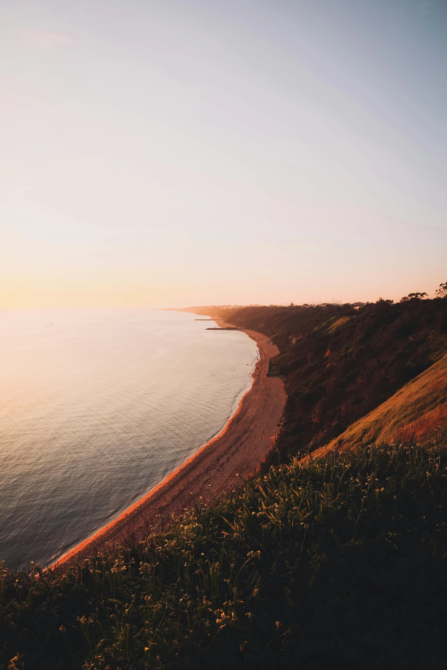 an image of sun coming up over a big body of water