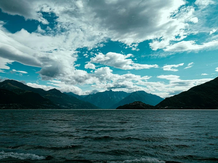 an image of clouds over a body of water