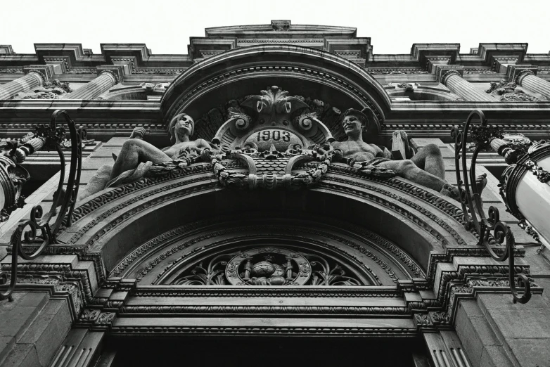 an old stone building with a sculpture above the door