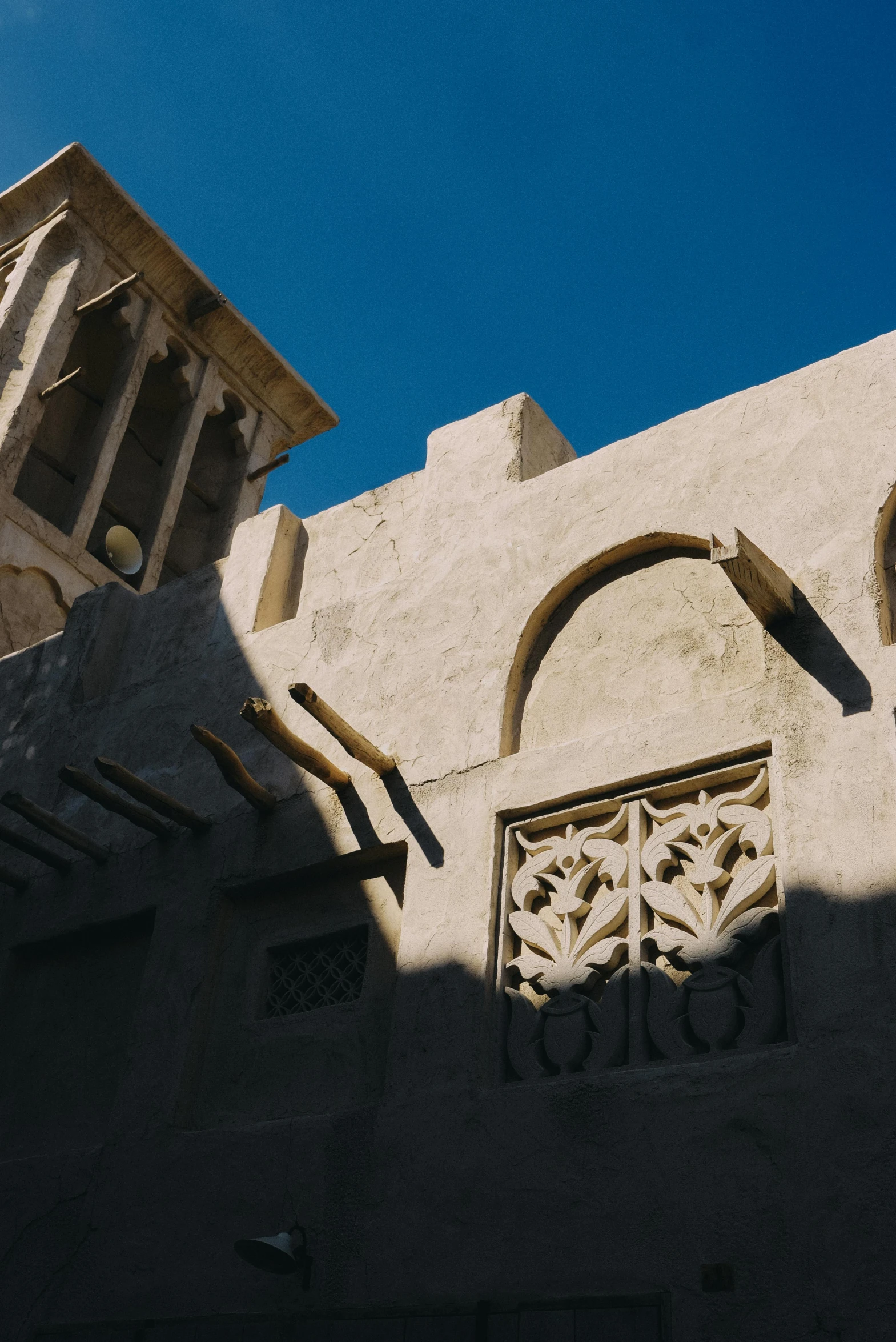 there is a stone building with a decorative window