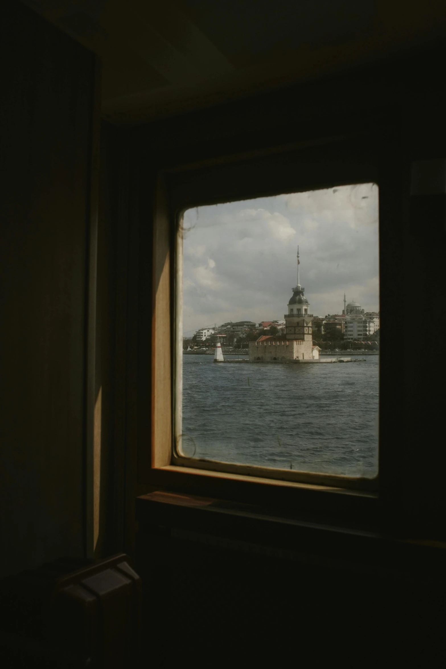 an urban landscape seen through a window