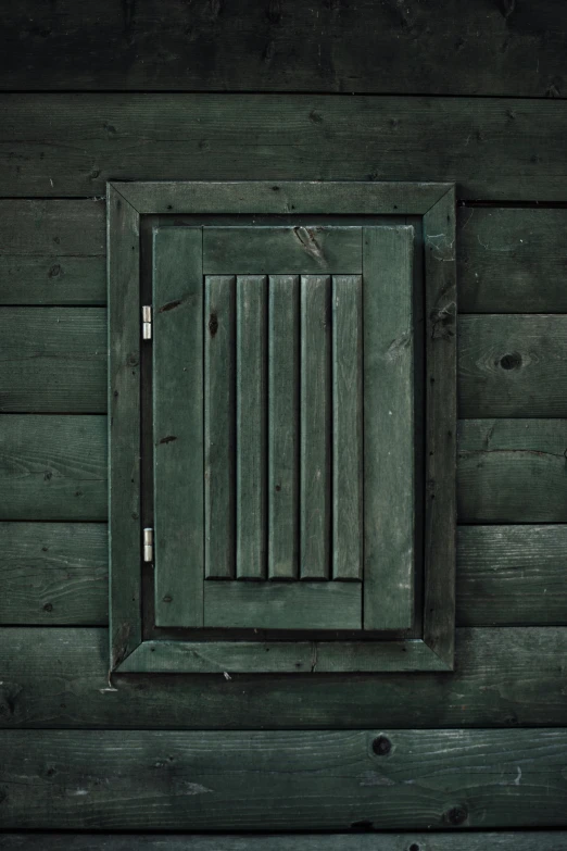 a close - up image of a window on wood