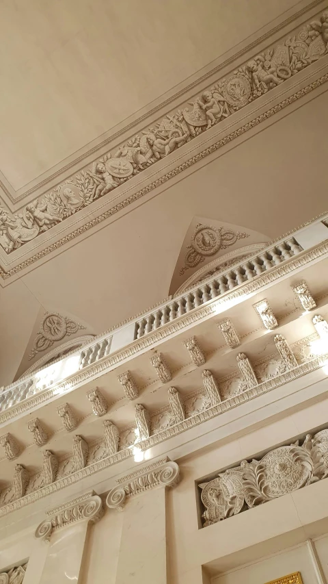 the ceiling and trim of a large white building