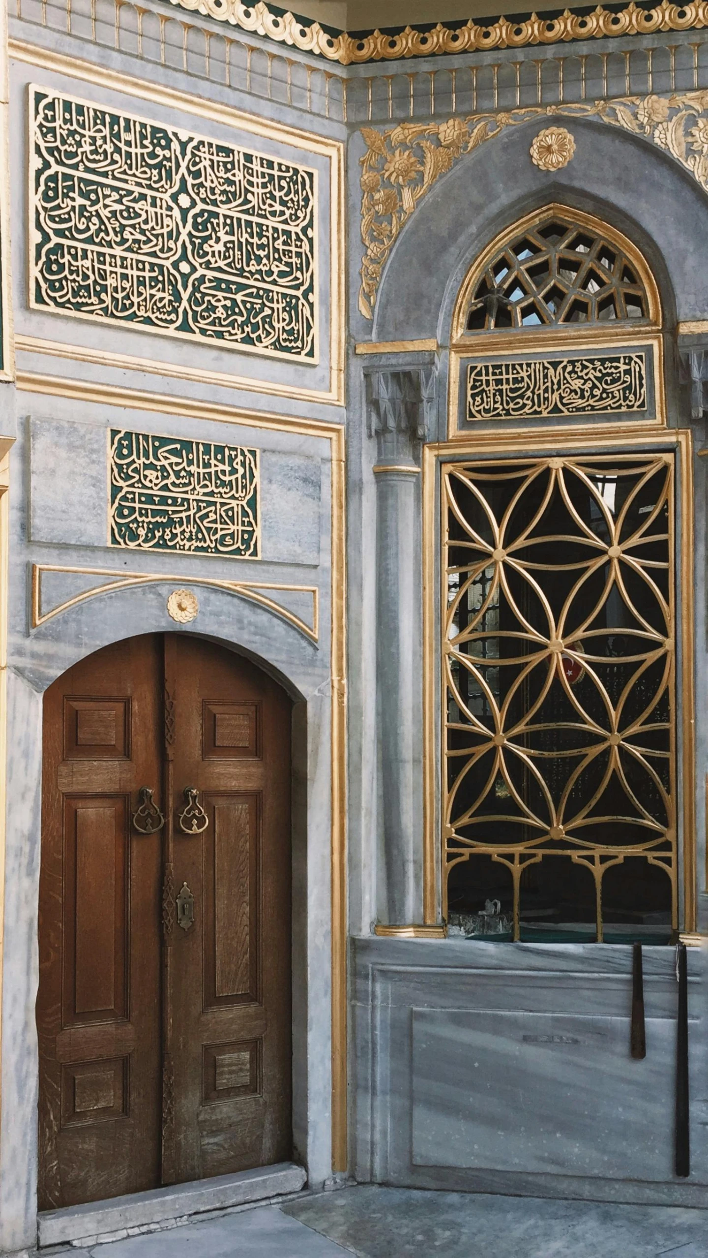 a doorway of a large ornate building with carvings and decorative elements