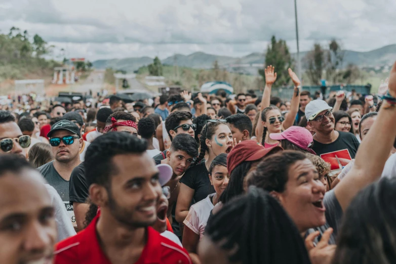 many people are looking up and smiling for the camera