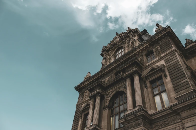 a picture of a building and clouds taken with a lens