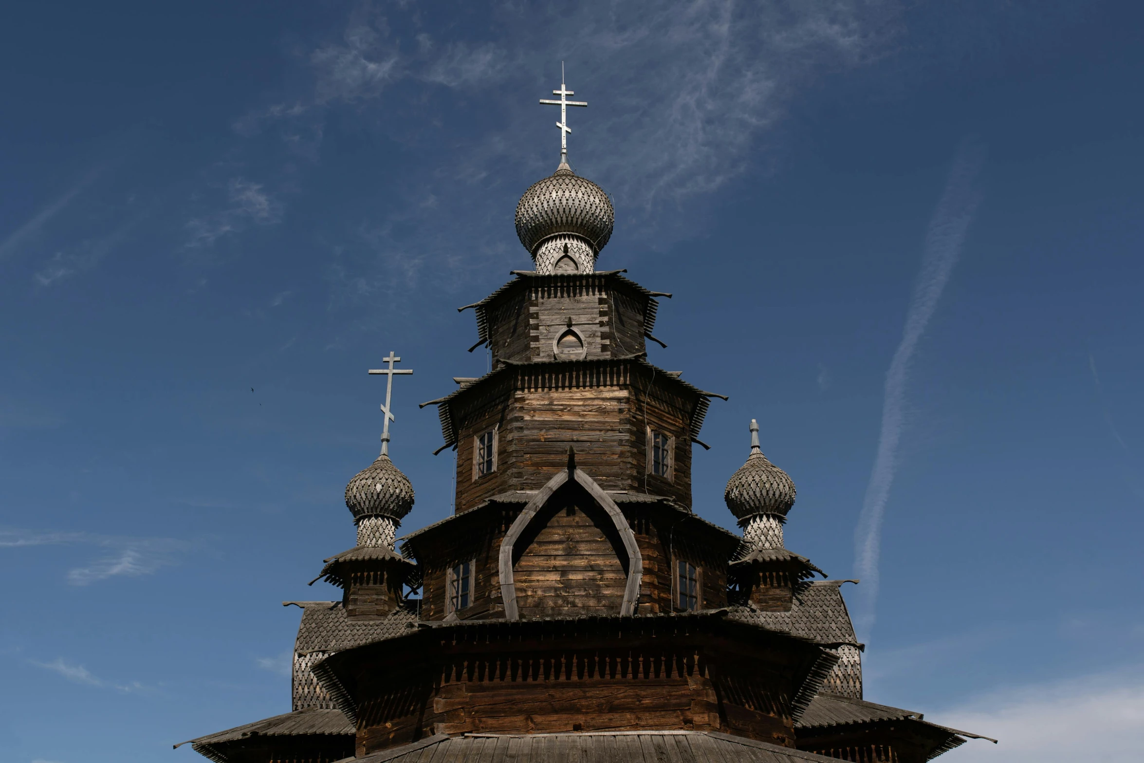 a tall clock tower sitting below a blue sky