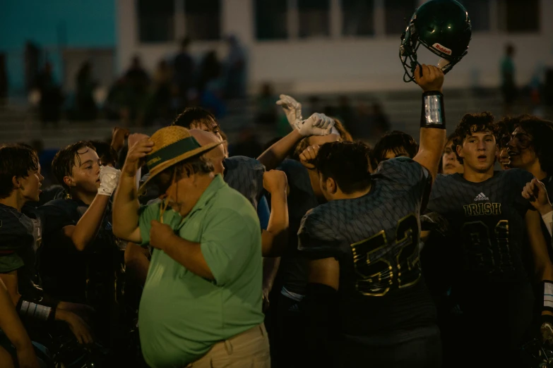 the boys are being pographed during a football game