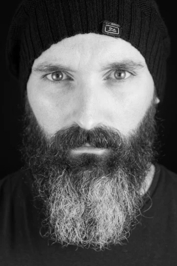 black and white pograph of man with beard