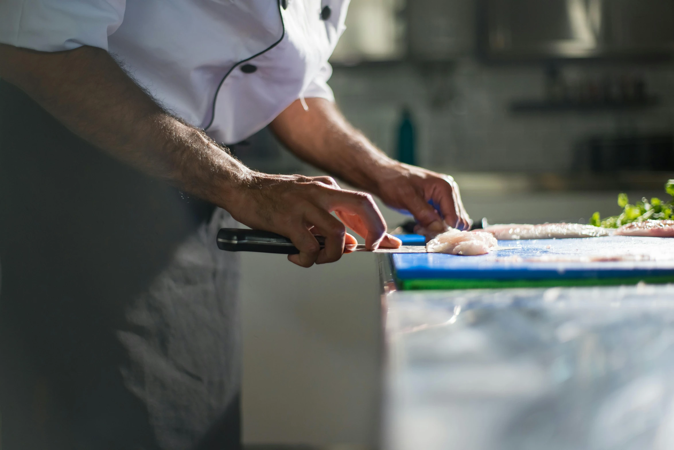 a person  food on a counter top with scissors