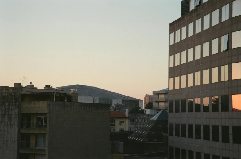 a couple of buildings with some lights shining