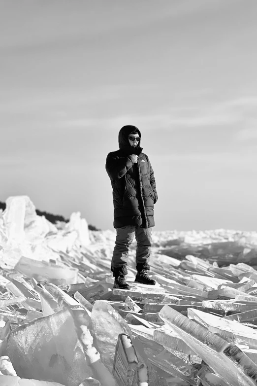 a person standing on ice with a camera in their hand