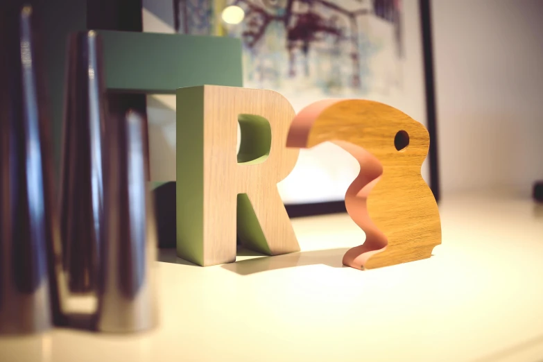 a wooden alphabet with the letter rr on it