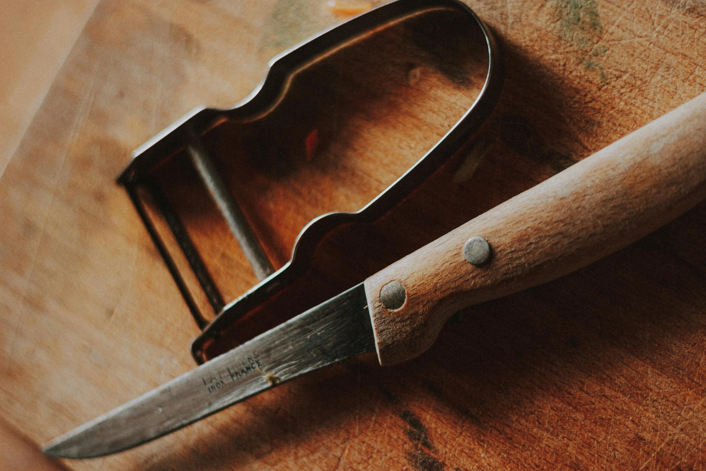 an old style  board and knife with a cutter