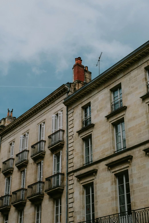 an old building with lots of windows and balconies