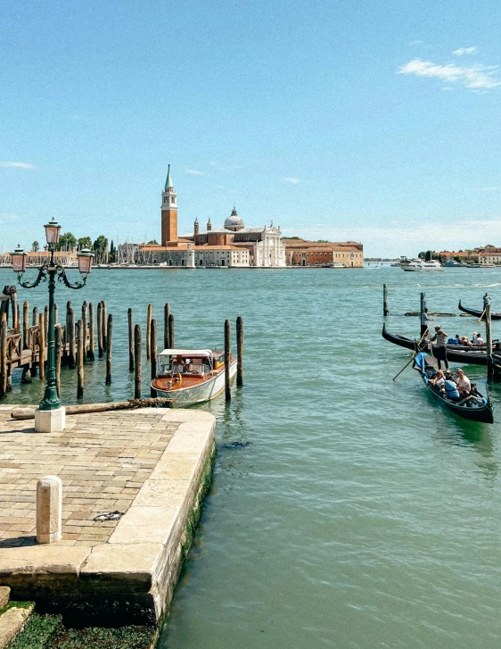 a body of water with boats in it and some buildings