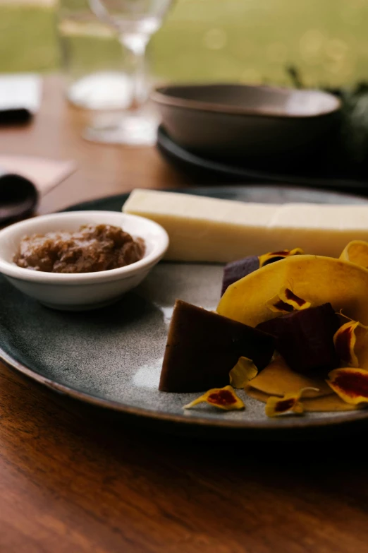 a plate with a piece of chocolate and a bowl with food on it