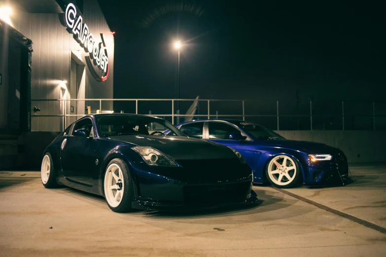 two cars parked in front of a business