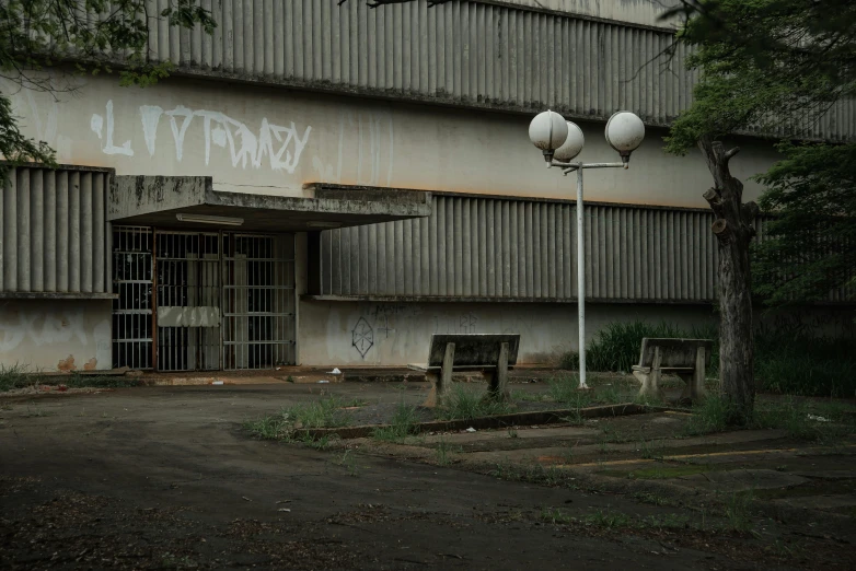 an empty parking lot with graffiti on the walls