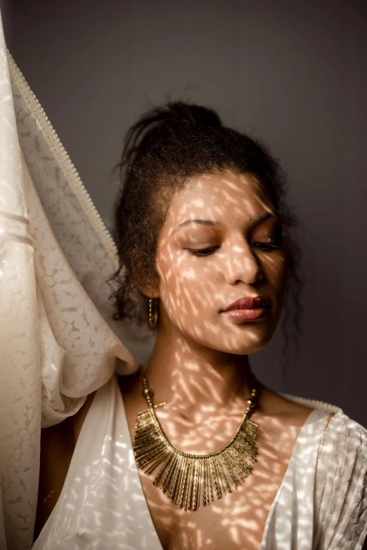 an image of woman with sun shadow on face