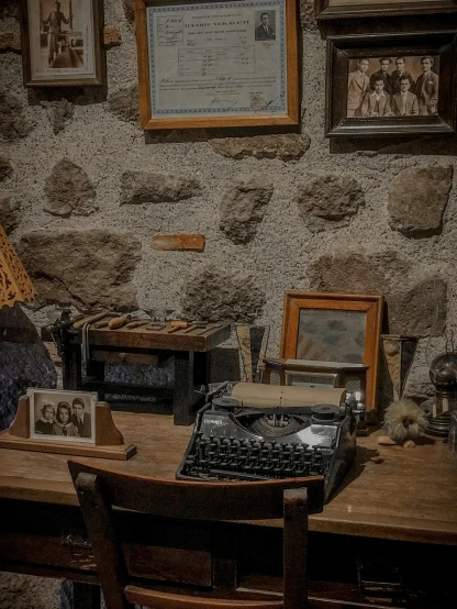 an old - fashioned typewriter on an antique desk with an old wallpaper