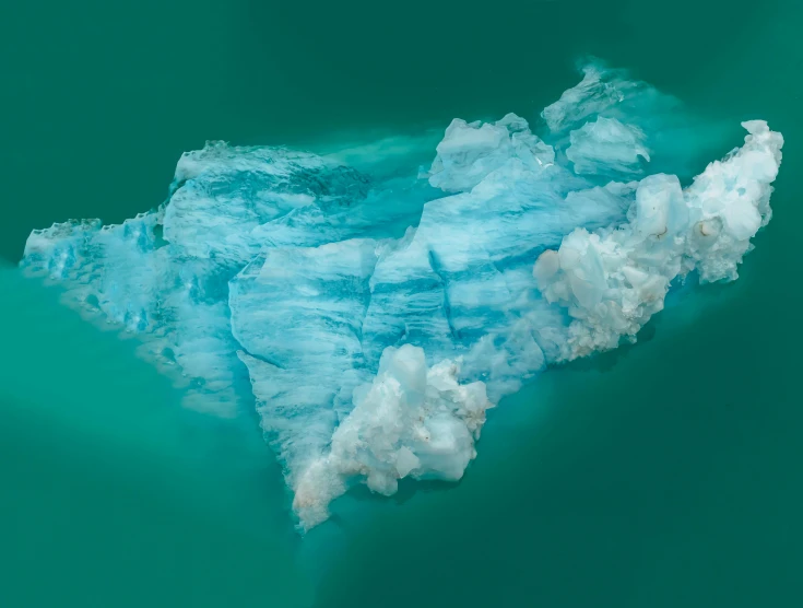 an iceberg seen from above with water below