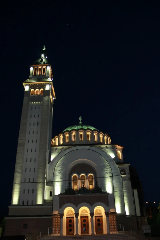 a very large building at night with the lights on